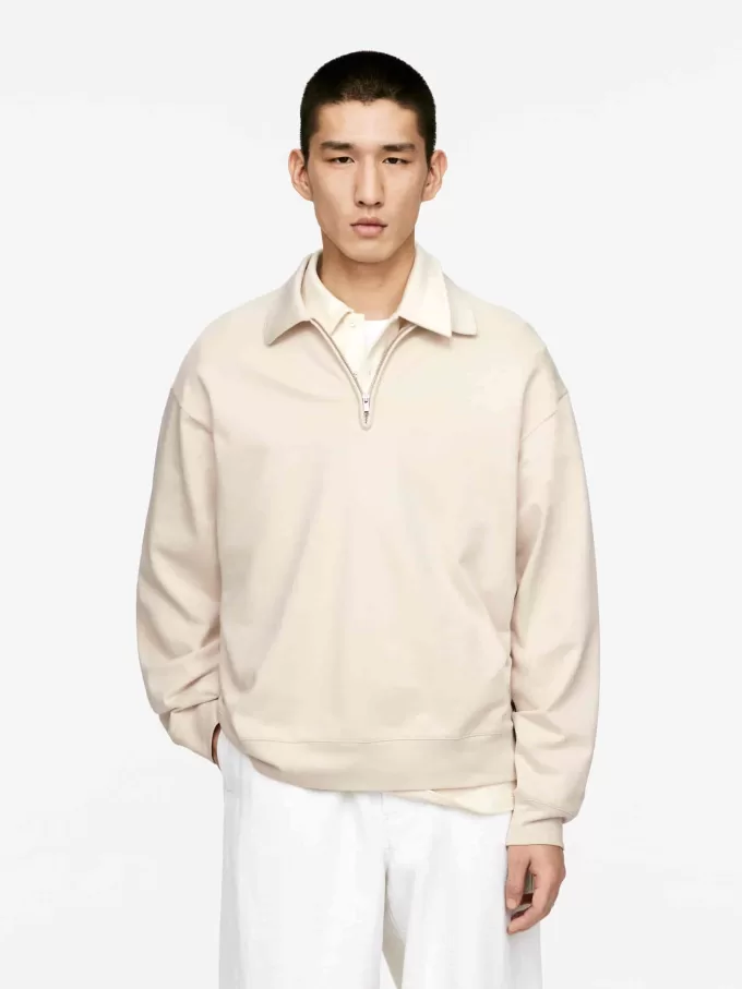 Poloshirt mit halbem Reißverschluss Poloshirt mit halbem Reißverschluss